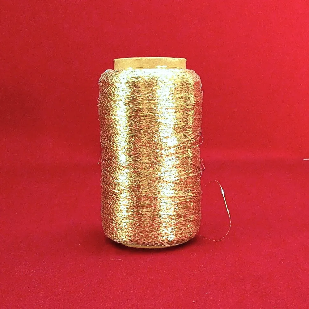 Used Spool of Gold Yarn on Spindle